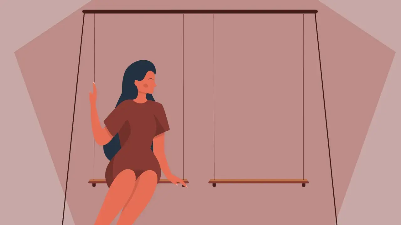 Ragazza su altalena, pensierosa, riflette su come capire se scrivergli o no.