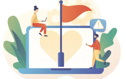 Persone analizzano cosa sono le red flags di una persona su un laptop con un cuore e una bandiera rossa.
