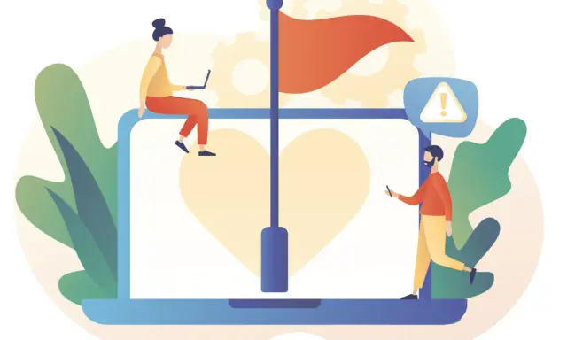 Persone analizzano cosa sono le red flags di una persona su un laptop con un cuore e una bandiera rossa.