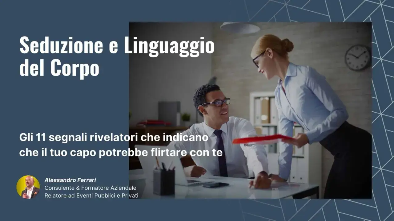 Uomo e donna in ufficio, lui sorride con interesse verso di lei. Titolo: 